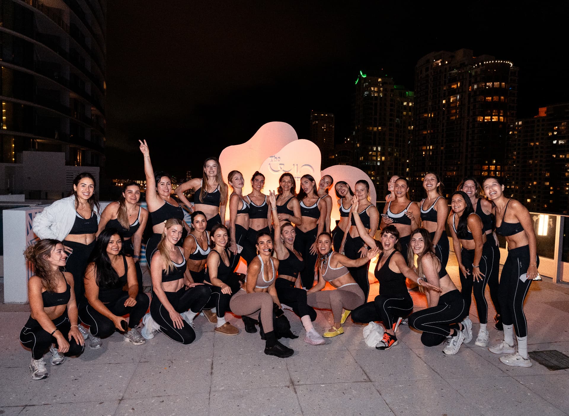 The full WIN community gathered together after a rooftop session